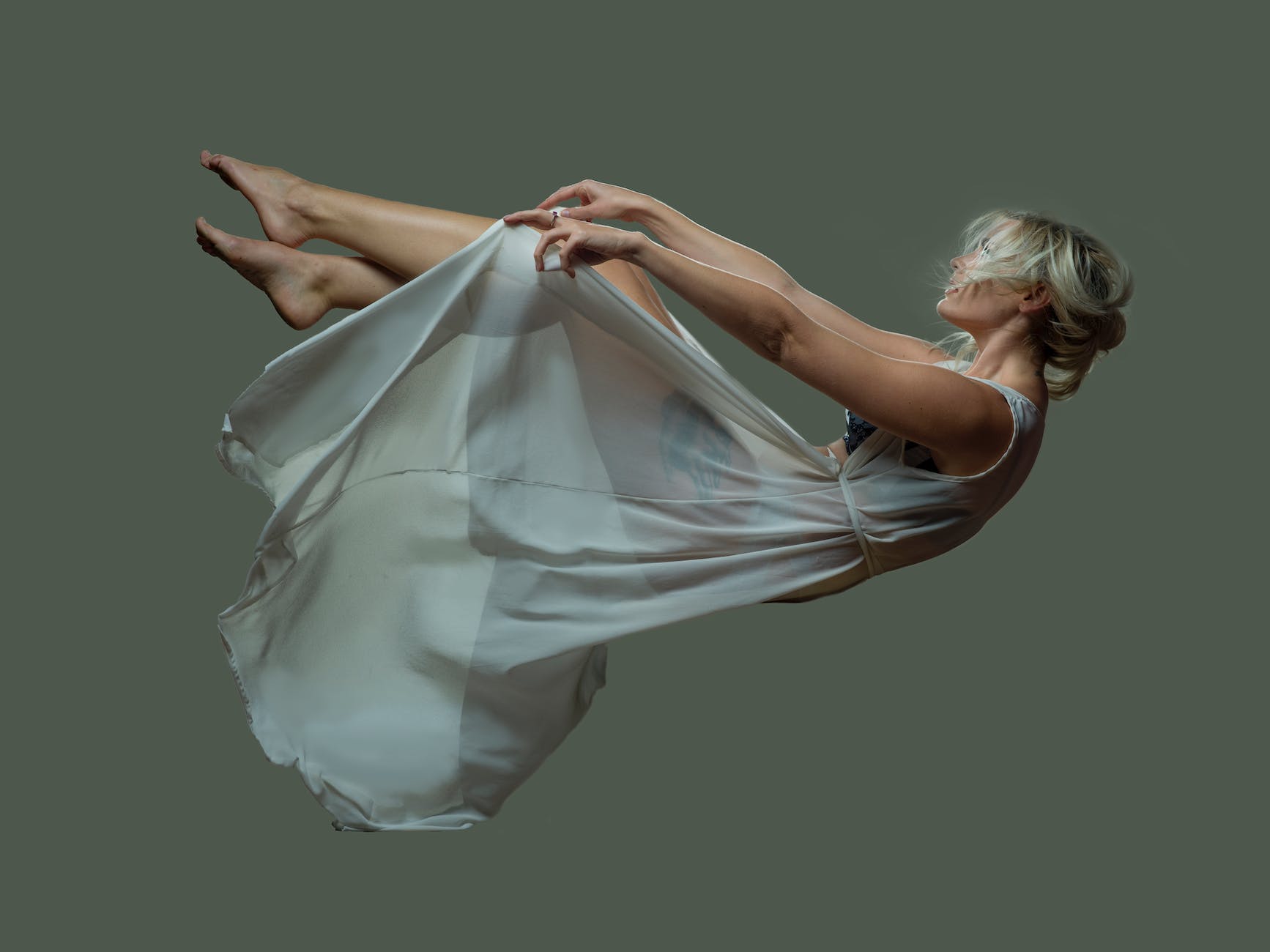 a falling woman wearing a sheer dress